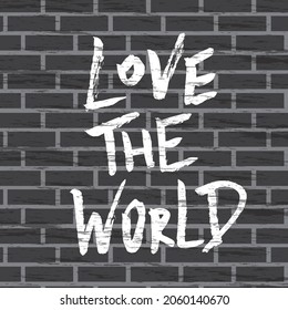 Amar el mundo, composición de letras positivas. Cita dibujada a mano en un estilo de graffiti callejero en una pared de ladrillo. Cita inspiradora. Imprimir para ropa, textil, pancarta, afiche, postal, pegatina