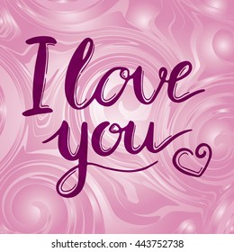 I love you calligraphy handmade on a pink background. Lettering for Valentines day.