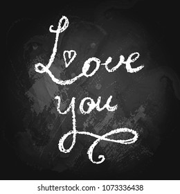 Love you handwritten phrase on chalkboard. Love phrase background