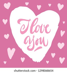 I love you lettering. Valentine's day card. Hand drawn calligraphy brush pen inscription in heart. Pink hearts around.