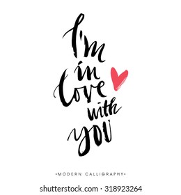 I'm in love with you. Modern brush calligraphy. Handwritten ink lettering. Hand drawn design elements.