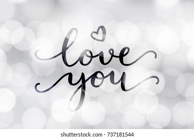 love you, vector lettering on blurred lights background, valentine card template