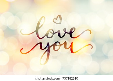 love you, vector lettering on blurred lights background, valentine card template