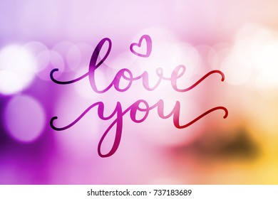 love you, vector lettering on blurred lights background, valentine card template
