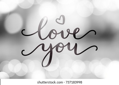 love you, vector lettering on blurred lights background, valentine card template