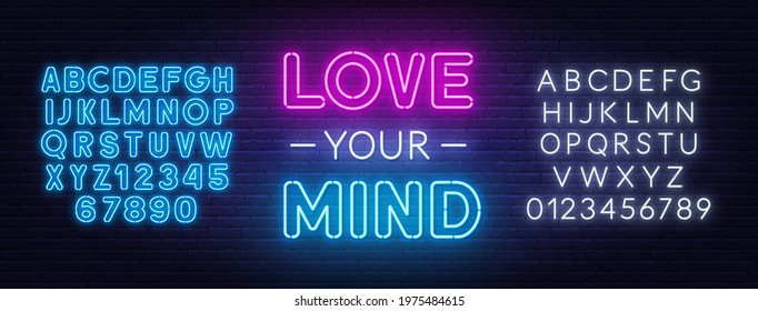 Love Your Mind neon quote on a brick wall background.
