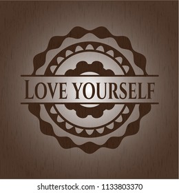 Love Yourself badge with wood background