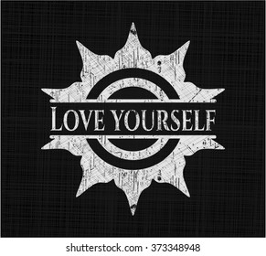 Love Yourself chalk emblem written on a blackboard