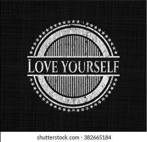 Love Yourself chalkboard emblem written on a blackboard