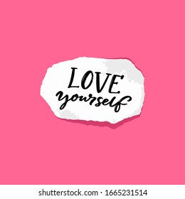 Love yourself. Positive quote about self acceptance. Handwritten note on torn piece of paper, pink background.