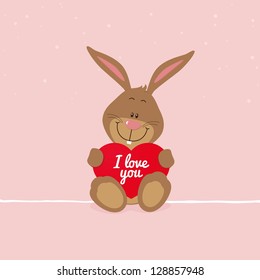 Lovely bunny with big red heart