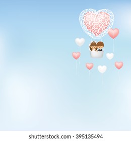 Lovely couple flying in hot air balloon surrounded with heart shape balloons