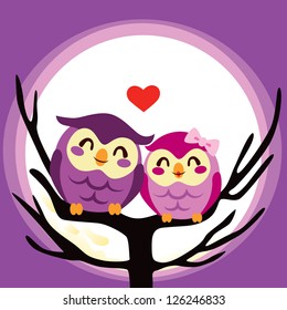 Lovely cute owl couple perched together on a full moon night
