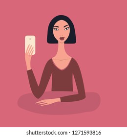 Lovely happy young girl Beautiful Asian woman with black short straight hair wearing red top sitting at table holding mobile phone in her hand Taking picture Make selfie Modern Technology concept Pink