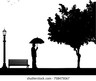 Lovely retired elderly man walking under the umbrella in park in autumn or fall, one in the series of similar images silhouette
