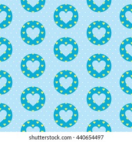 Lovely seamless pattern with a heart shape inside the circle and polka dot background. Baby blue and yellow colors.