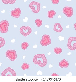 Lovely seamless vector pattern with fun snake textured heart shapes on light blue background for scrapbooking, fabric, wallpaper. Surface pattern design.