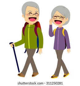 Lovely senior couple laughing and talking walking wearing climbing clothing and equipment