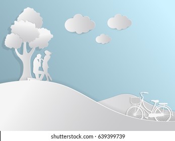 Lovely young couple sit for love under the tree abstract blue background with bicycle for valentine's day festival .Vector illustration.paper cut style.