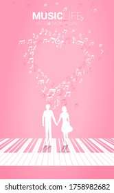 Lover couple holding hand standing on piano key with music melody note dancing flow . Concept background for love song and concert theme.