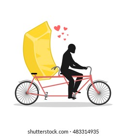 Lover gold. Golden bullion on bicycle. Lovers of cycling. Man rolls fast food on tandem. Joint walk with wealth. Romantic date
