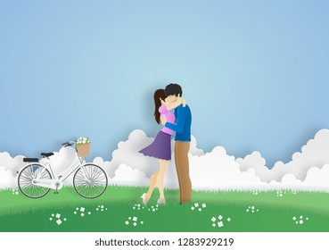 lover hugging in the meadow with clouds and bicycle on background. origami, valentine, paper art concapt.