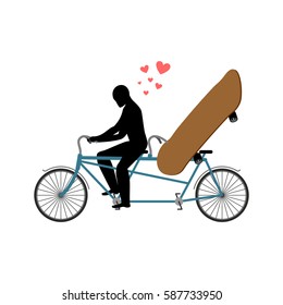 Lover skateboarding. Skateboard and guy on bicycle. Lovers of cycling. Guy rolls boarder in tandem bike. love extreme sport. Romantic date.
