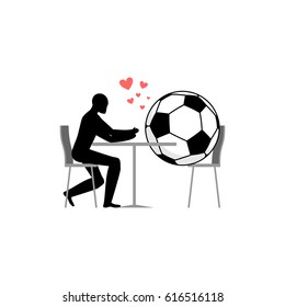 Lover Soccer. football ball and guy in cafe. Lovers in restaurant. Romantic date. Love sport play game 