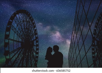 Lovers in amusement park at night. Vector illustration with silhouette of loving couple under starry sky. Ferris wheel and glass building