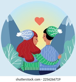 Lovers sit against the backdrop of mountains in winter hats