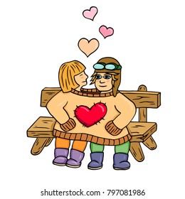 lovers sit on a bench dressed in one sweater with a heart, hug and kiss