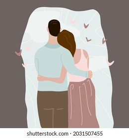 The lovers are standing in an embrace against the background of the blue sky. View from the back. Delicate pastel colors. Valentine's day. Strong relationships. Love is in the air.