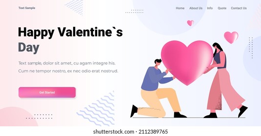 loving couple holding pink heart man woman in love celebrating happy valentines day horizontal