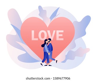 Loving couple hugging. Tiny people with big heart. Romantic date concept. Characters Valentine day. Modern flat cartoon style. Vector illustration on white background