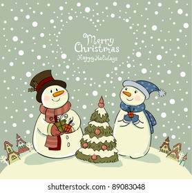Loving couple of snowmen with gifts beside christmas tree.
