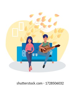 A loving guy plays the guitar for a girl. The concept of recognition of love, communication, spending time together.