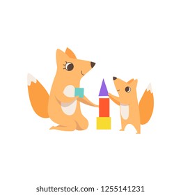Loving mother fox playing with a toy pyramid with her little baby, animal family, parenting concept vector Illustration