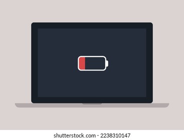 Un icono de batería baja que aparece en la pantalla de un portátil, problemas de nuevas tecnologías