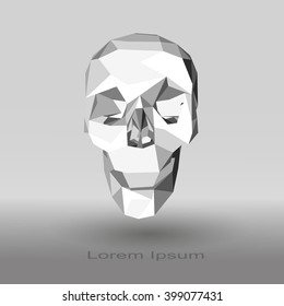 Low poly human skull in gray tones on a gradient background.