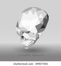 Low poly human skull in gray tones on a gradient background.