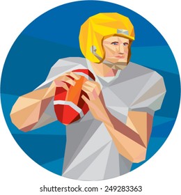 Low polygon style illustration of an american football gridiron quarterback player holding ball facing side set inside circle on isolated background. 