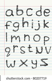 Lower case scribble alphabet on a notebook paper