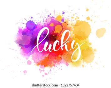 Lucky - handwritten modern calligraphy text on watercolor paint splash background.