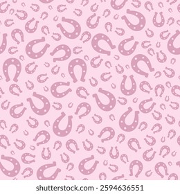 Lucky horseshoe. Pink silhouette. Seamless vector pattern. Endless ornament. Isolated pink background. St. Patricks Day. Flat style. Repeating symbol of happiness and good luck. Abstract image.