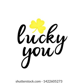 Lucky you hand drawn lettering with golden shamrock. Can be used as t-shirt design, greeting card