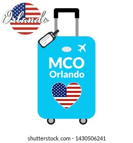 Luggage with airport station code IATA or location identifier and destination city name Orlando, MCO. Travel to the United States of America concept. Heart shaped flag of the USA on the baggage