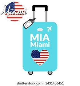 Luggage with airport station code IATA or location identifier and destination city name Miami, MIA. Travel to the United States of America concept. Heart shaped flag of the USA on the baggage