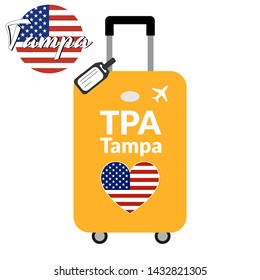 Luggage with airport station code IATA or location identifier and destination city name Tampa, TPA. Travel to the United States of America concept. Heart shaped flag of the USA on baggage