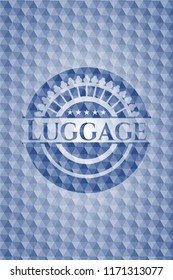 Luggage blue emblem with geometric pattern background.