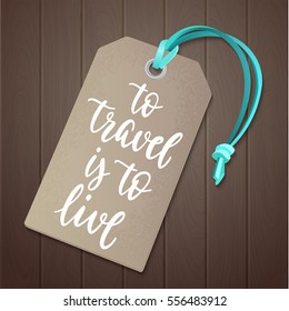 Luggage tag with travel inspiration quote. Decorative vector illustration and handwritten brush lettering for your design. Journey item with modern style calligraphy on wooden background.